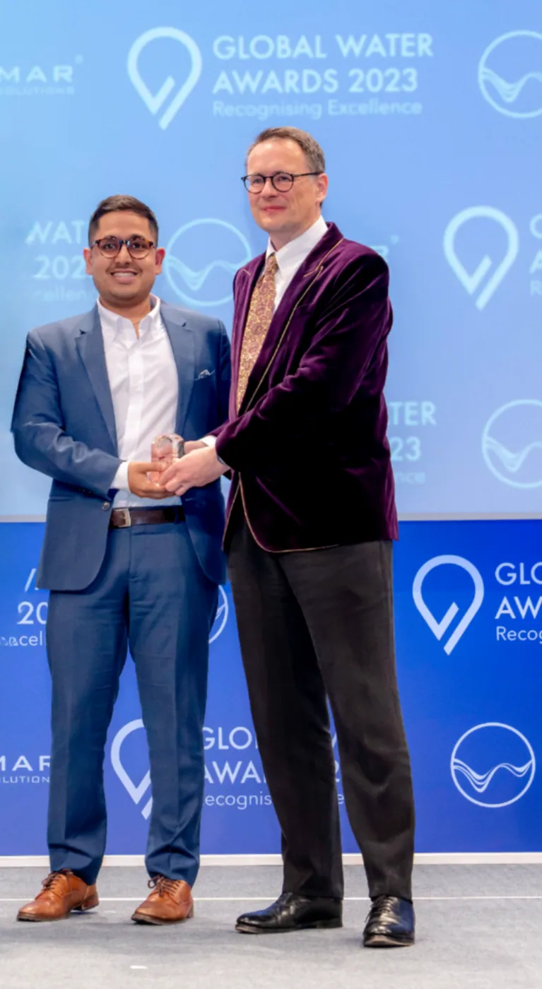 Belidor AI CEO accepting award on stage