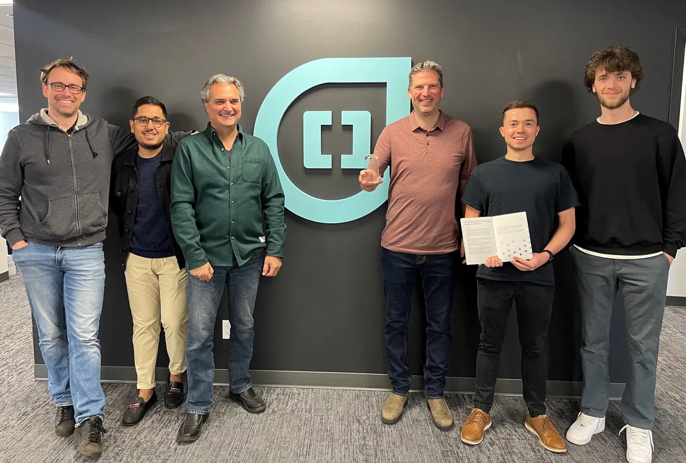 Belidor AI team members with the Distinction Award at Belidor AI HQ